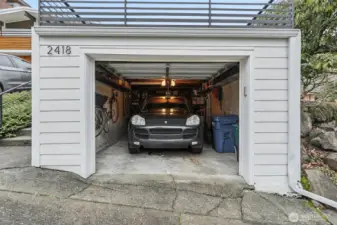 Garge comfortably houses most mid size SUV's plus additonal storage / shelving