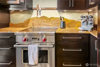 Kitchen set within the historic structure of the former Our Home Hotel, where original character carries forward