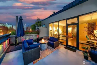 View Rooftop Terrace framing rail lines, piers, and the working edge of the waterfront