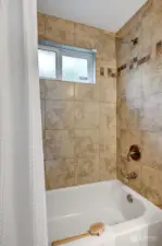 Main hall full-tiled bath with tub/shower.