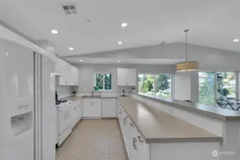 The large kitchen has an abundance of counter space and cabinets...