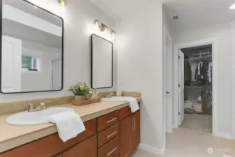 En suite bathroom with large walk-in closet.