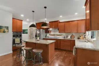 Tons of cabinetry, large pantry, & stainless steel appliances.