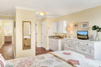 Nicely sized primary with sink vanity to get ready in the morning, closet is opposite.