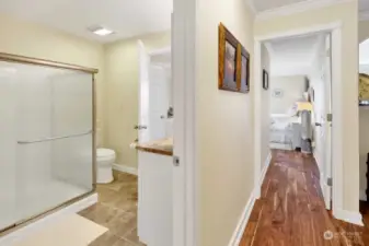 Hallway with full bath separates the bedrooms.