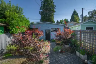 Backyard leading to detached huge garage