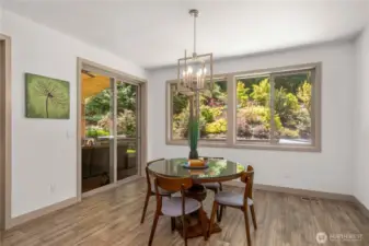 Off the sits a dining area with direct access to the backyard