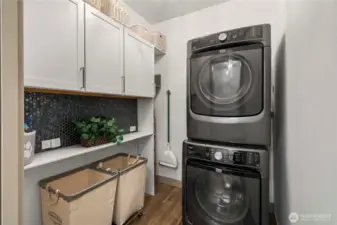 Washer and dryer stay! Located just off the mudroom is this handy laundry room!