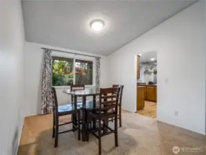 The formal dining space conveniently resides adjacent to the kitchen.
