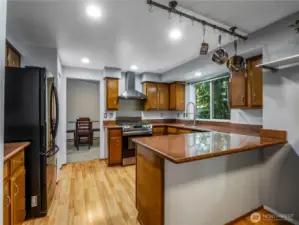 The abundant kitchen has lots of upgrades and includes two large, deep pantry closets adding to the plentiful storage options.