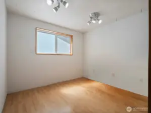 This space is an extra finished room in the garage. It's perfect for storage, shop space,