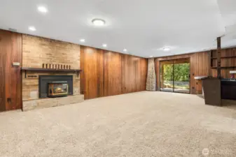 Great room w/ wet bar, propane fireplace and slider to the covered patio