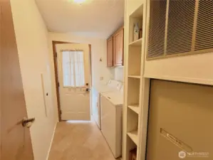 Hallway to Carport w/Laundry & Storage