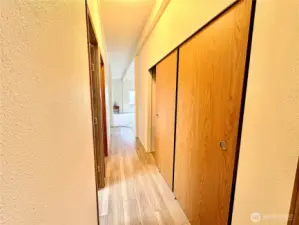 Hallway from Bedrooms to the Living Room-Storage Closet opposite Carport back door.