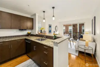 View toward living area and private covered balcony beyond.