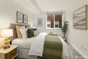 Surprisingly spacious bedroom. Easily fits another office space. To the left is a large closet and en-suite bath.