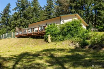 Stick Built Bunkhouse has great room, kitchenette, 1 bedroom with large bath/laundry with radiant heated floors. Outside deck gets warm, sunsets.
