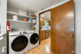 Back to the other side of the house, the laundry off of the kitchen. This area leads to the family room area.