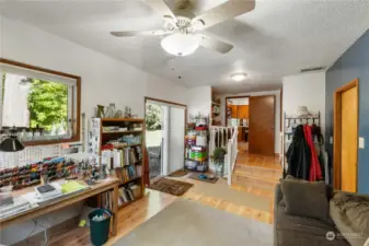 This space as you can see is a few steps down from the kitchen & laundry. There is a slider to the back yard and a human door (righ side of the photo) to the garage.