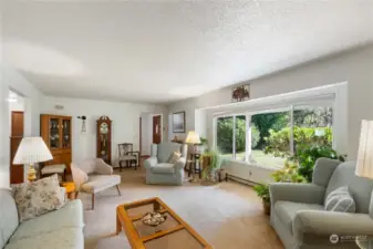 Looking back at the entry. doorway on the left past the lamp it to the dining, kitchen, laundry and the casual rooms of the house. Also entry to the garage is that way.