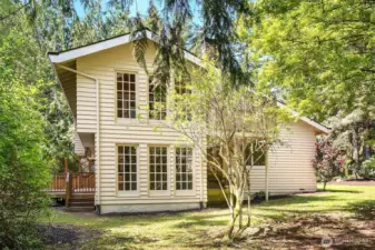 Side view of sunroom and brick room