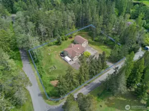 Located just beyond the limits of the Town of Friday Harbor on a very large, level, sunny lot this three bedroom single level home has an attached two car garage and a detached shop with oversized door