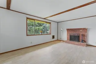 Bright and spacious living room with cozy fireplace