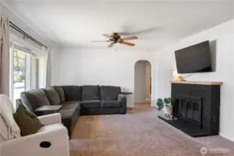 Living room with wood burning fireplace