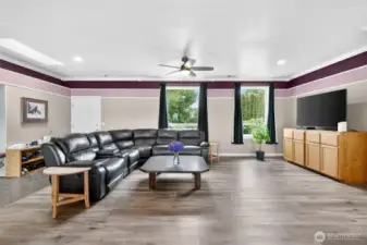 Living room with large windows and versatile layout options