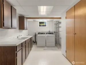 Large laundry room with sink and tons of storage