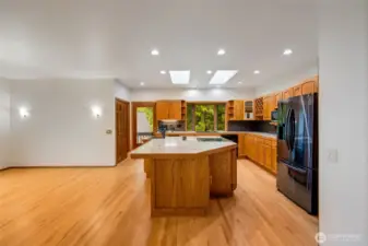 Gorgeous hardwood floors continue in this gormet kitchen with not one but two pantry spaces.