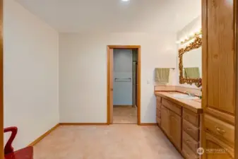 Large vanity and storage cabinet with flex space to add additional storage or vanity with a door that separates the water closet.
