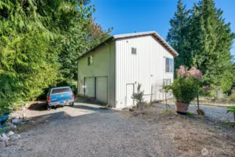 Detached 2,400 sqft, two story shop with wrap around driveway that leads to second property access.