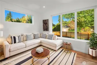 Den/4th bedroom on the main level is a great size to be that flex room you want. It has huge windows allowing in lots of natural light and overlooking the front yard with it's elegant landscaping. 1 of 2 pictures virtually staged.