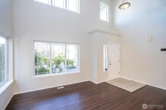 The entry opens to a bright and welcoming living area filled with natural light.