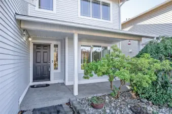 The covered front porch offers a welcoming space to sit back and relax.