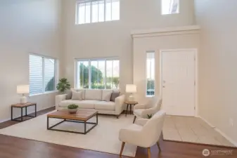 The entry opens to a bright and welcoming living area filled with natural light.