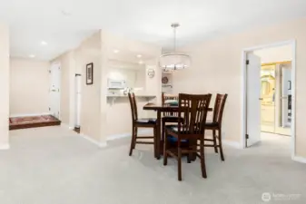 Open sightlines connect the living room to the dining and kitchen areas for effortless entertaining.