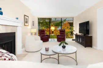 Open sightlines connect the living room to the dining and kitchen areas for effortless entertaining.