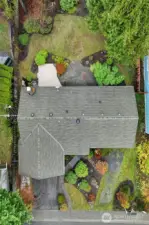 The home is surrounded by beautiful garden spaces and a storage/gardening shed for additional storage.