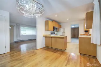 Through the kitchen is the bonus room that has a sliding door to the beautiful backyard.