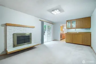 In addition to the living room, there's a bonus room that opens to the deck in the back yard. A wood burning fireplace will keep you cozy in the winter.