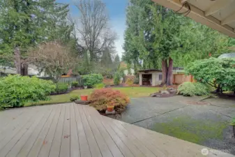 Enjoy sounds of the little pond fountain by the composite deck or a fire pit on the patio. Good sized storage building out back.