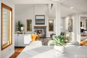 This photo shows the beautiful flow of the spaces, including the den, home office, or extra guest room on the right.