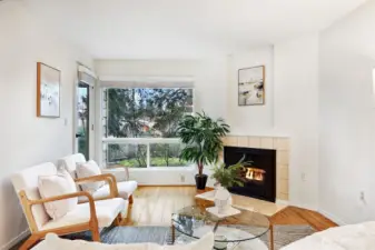 Cozy gas fireplace and convenient door to covered deck.