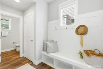 cute little area as you come in from the garage, you will find a powder room and closet in this space as well