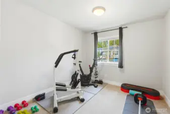 additional upper level bedroom, currently set up as a exercise room
