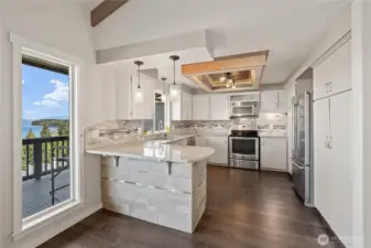 Stainless steel appliances in updated kitchen.