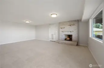 Bonus family room with wood burning fireplace.
