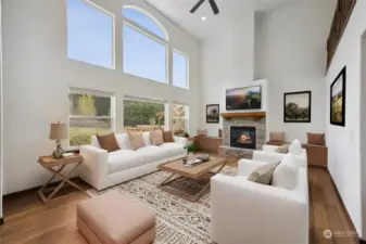 Large living room picture windows let in all the southern facing sun! (Photo digitally staged)